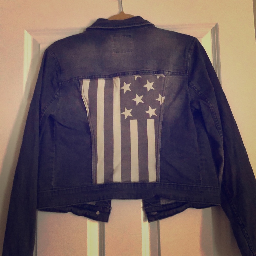 Black jean jacket w/ American flag.